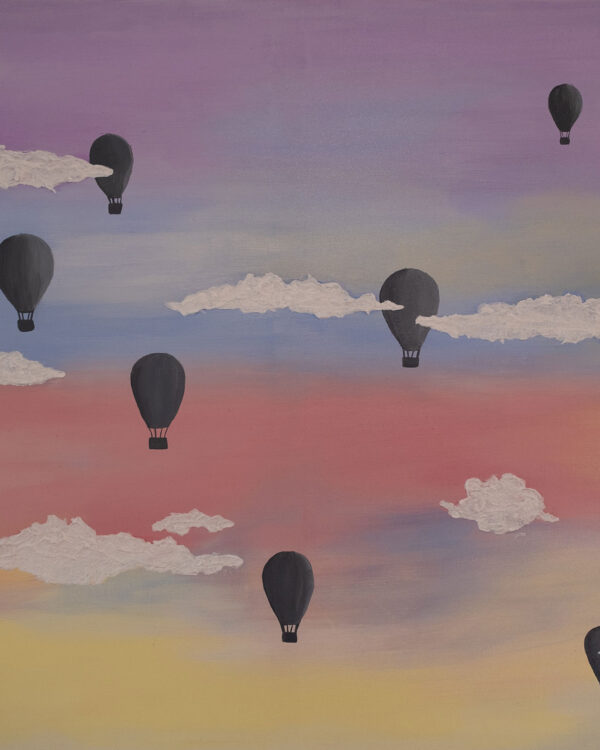 Balloons over clouds